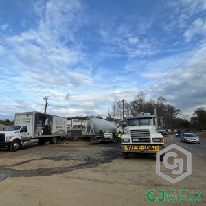 Mobilization of CJGeo's dry batch cellular grouting plant for the Paw Creek sewer abandonment project in Charlotte.