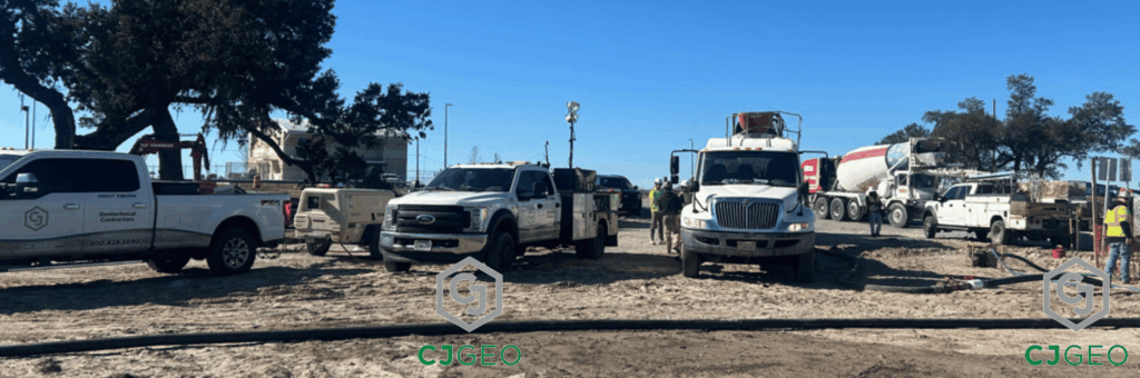 multiple CJGeo trucks, a concrete pump & ready mix truck onsite for hdd conductor casing grouting
