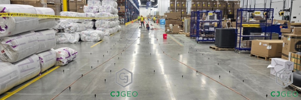 a large warehouse with people working on the floor